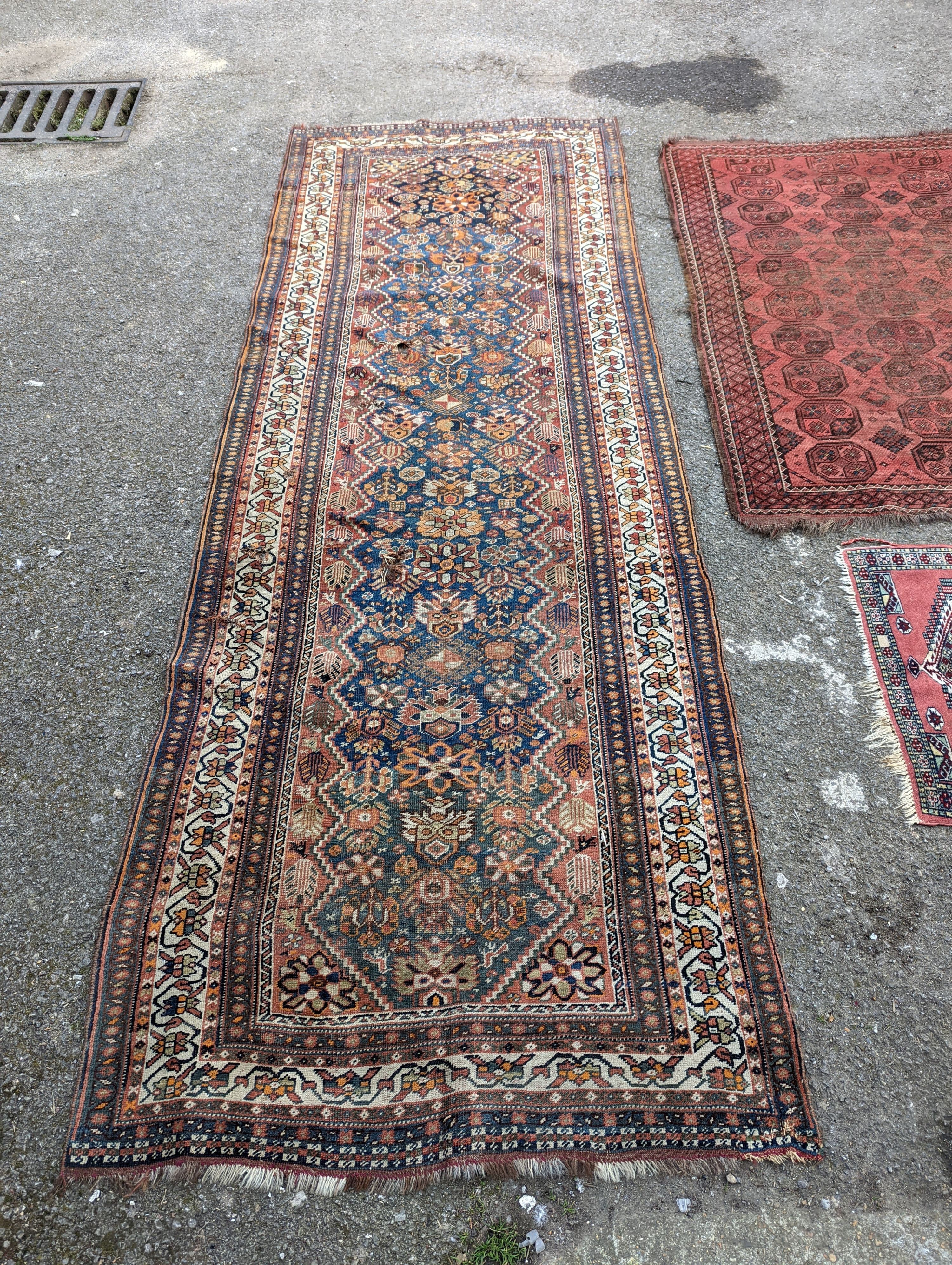 A North West Persian blue ground runner, 300 x 109 (worn and holed) a North West Persian rug, Bohara rug and mat